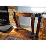 A Regency rosewood console table with a red marble top and gilt metal mounts; 105cm wide; 87cm high;