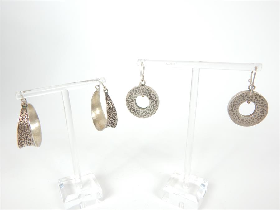 Two pairs of attractive, contemporary, circular, sterling silver earrings