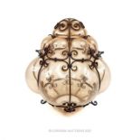 An ornate mould blown glass hanging light shade, with a wrought iron frame