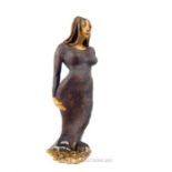 A large clay and slip glaze full length female sculpture