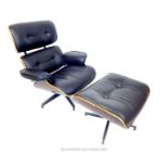 A contemporary black faux leather and plywood armchair with matching stool