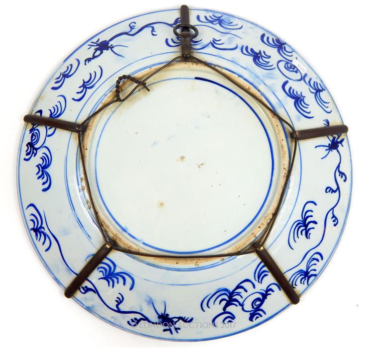 A large late 19th century Japanese hand painted blue and white charger - Image 3 of 3