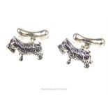 A pair of silver dog and bone cufflinks;