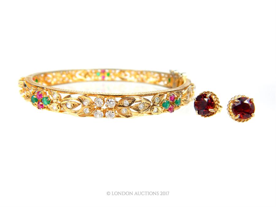 A pair of 9 ct yellow gold, garnet, stud earrings with a gem-set, yellow-metal bangle - Image 2 of 2