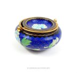 A Chinese cloisonne ashtray decorated with flowers on a blue ground