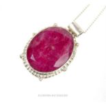 A large, natural, treated ruby and sterling silver pendant and chain
