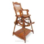 A Victorian style metamorphic child's high chair, folding to become a child's chair with play table