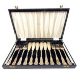 A boxed set of six, silver-plated, fish knives and forks