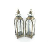 A pair of large gilt metal storm lanterns