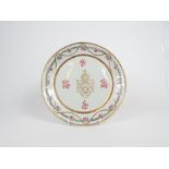 A Chinese porcelain Armorial plate, decorated in the famille rose palette, with gilded detail