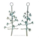 A pair of distressed metal tree form candelabra, having hoop handle over sixteen graduated branches