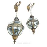 A pair of spherical gilt metal and glass hanging lanterns