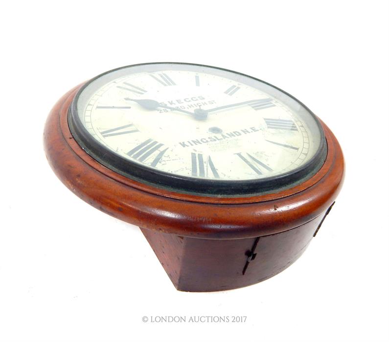 A Victorian mahogany circular wall clock from Hackney, with Roman numerals