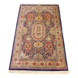 A fine-quality, signed Persian silk Qum rug