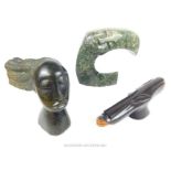 Three carved African carved stone sculptures