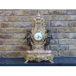An Italian, 20th century, gilt metal and pink marble mantle clock and garniture set