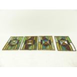 A set of four small late 19th / early 20th century rectangular stained glass panels