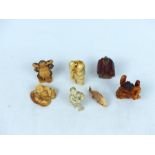 A collection of Japanese carved ivory netsuke