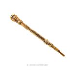 A Victorian, yellow metal miniature extending pencil with amethyst finial