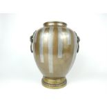A late 19th century Japanese Bronze vase inlaid with pewter and decorated with ring handles in the