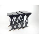 A nest of four Regency, ebonised tables