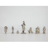 Seven Indian, 19th century miniature Solid-Cast Silver Deities, including Krishna (4.5cm high).