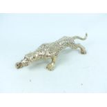 A Chinese silvered figure of a crouching leopard