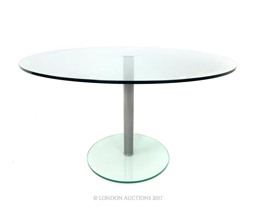 A contemporary circular glass table, raised on a brushed steel stem - Image 2 of 2