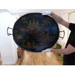 A large oval Chinese painted metal tray