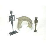 Two, contemporary, roughly cast and abstract base metal figurines