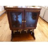 A fruitwood bar cabinet