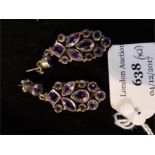 A pair of sterling silver and amethyst drop stud earrings