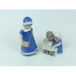 A Danish B&G, figurine of a pouting little girl (17cm high) together with a smaller figural group of