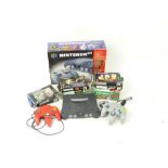 A Nintendo 64 with instruction manual, two controllers and boxed games