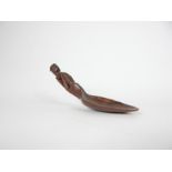 A 20th century carved ritual wooden spoon of the Ifugao People, Luzon, Philippines; 15cm long.