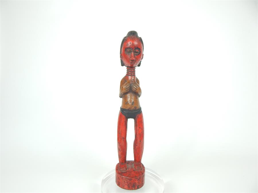 A 20th century tribal African carved light wood, female fertility figure, from the Fante People,