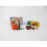 A Corgi Toys Massey-Ferguson 65 Tractor with shovel (53) with red and white paintwork and original