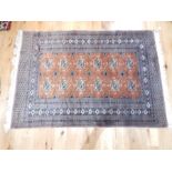 A late 20th century, Persian silk and woolen rug; with brown ground; 6' x 4'.