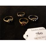 Three vintage, yellow gold rings with one vintage, silver ring
