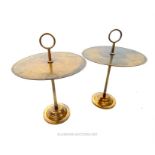 A pair of bronzed metal side tables