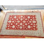 A Persian Ziegler, red ground rug; 234cm x 150cm.
