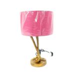A contemporary bronzed table lamp in the form of flamingo's legs, with a pink shade
