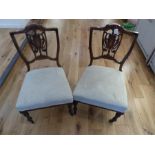 A pair of Edwardian Rosewood and inlaid side chairs