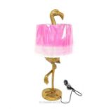 A contemporary bronzed table lamp in the form of a flamingo, with a pink shade