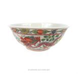 A Chinese porcelain bowl hand painted in the Wucai palette; 163 cm diameter