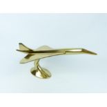 A brass Concorde on stand; 51 cm long.