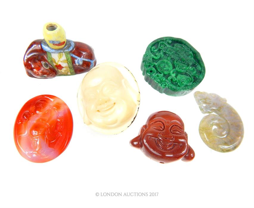 A collection of carved Chinese items, including jade, agate and taguna nut; also a small ceramic