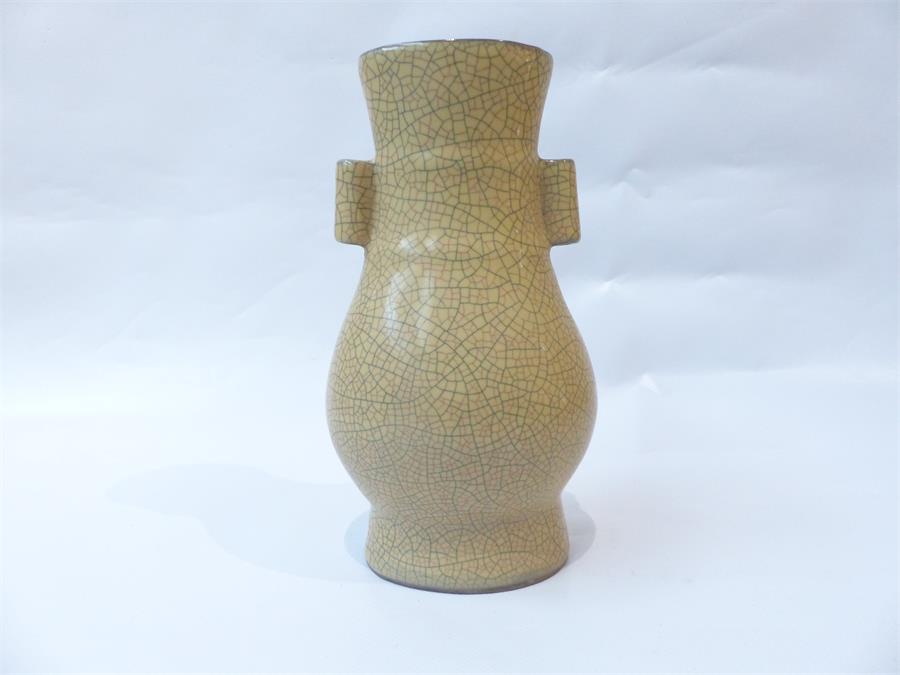 A Chinese crackle glazed vase, with twin handles.