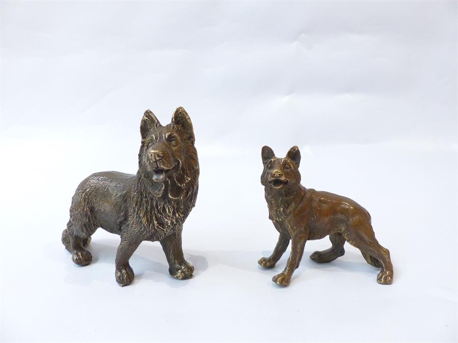 A pair of bronze dogs.
