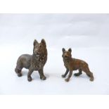 A pair of bronze dogs.